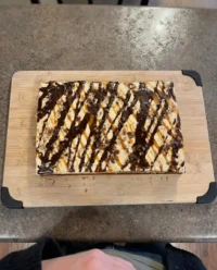 A 9x13 chocolate cake with 60 holes poked using a wooden spoon