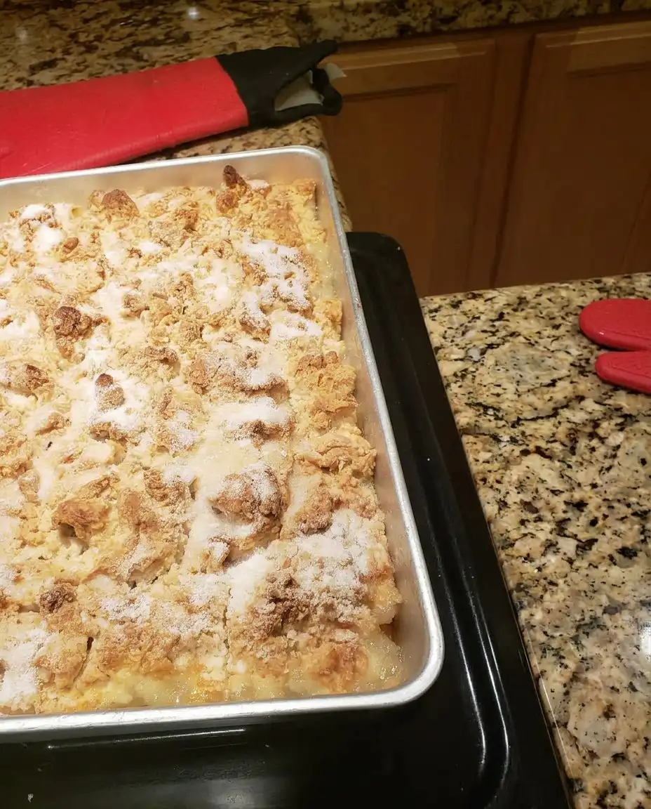 Paula Deen Peach Cobbler 10 Paula Deen Peach Cobbler with a golden brown crust in a glass baking dish
