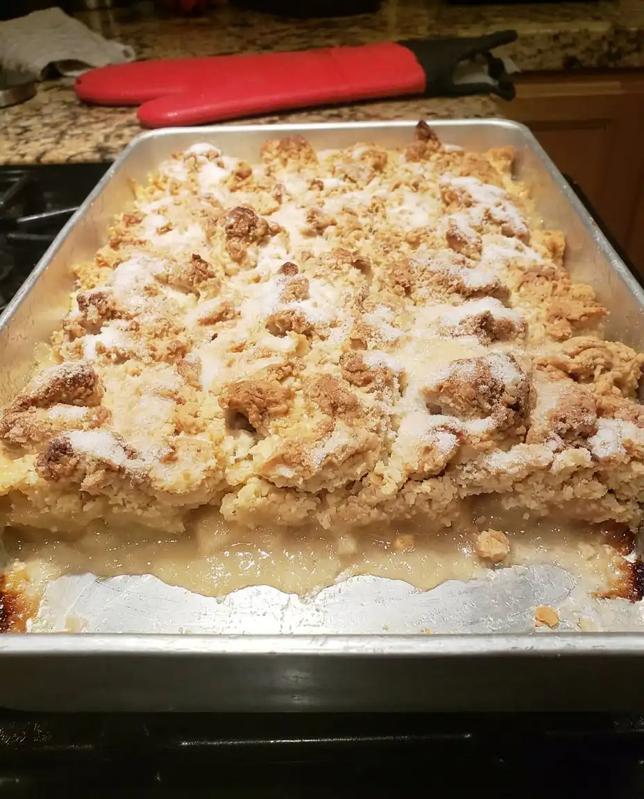 Paula Deen Peach Cobbler 14 A serving of peach cobbler topped with vanilla ice cream