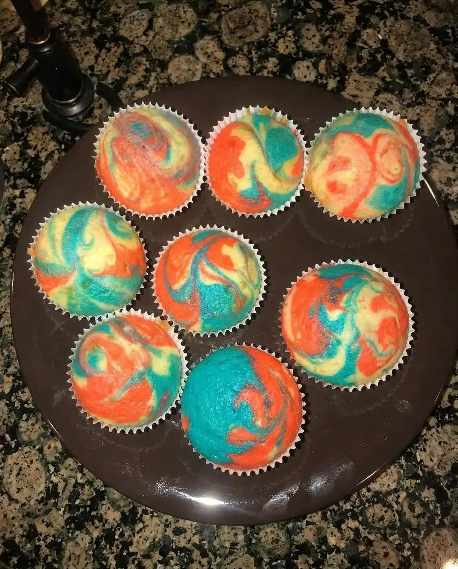 Patriotic Chocolate Cupcakes with Cake Mix 13 Close up of piping a blue and white frosting rosette on a cupcake