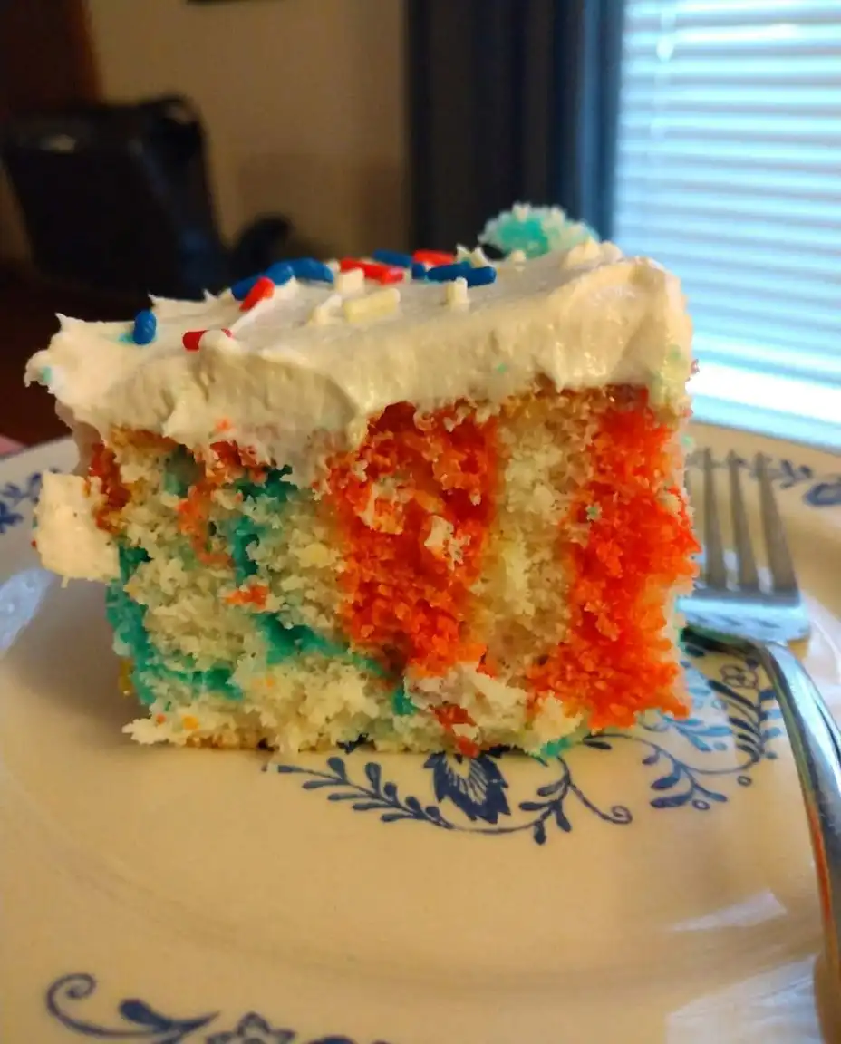 Red, White & Blue Patriotic Poke Cake 13 A white cake with holes poked in it ready for gelatin filling.