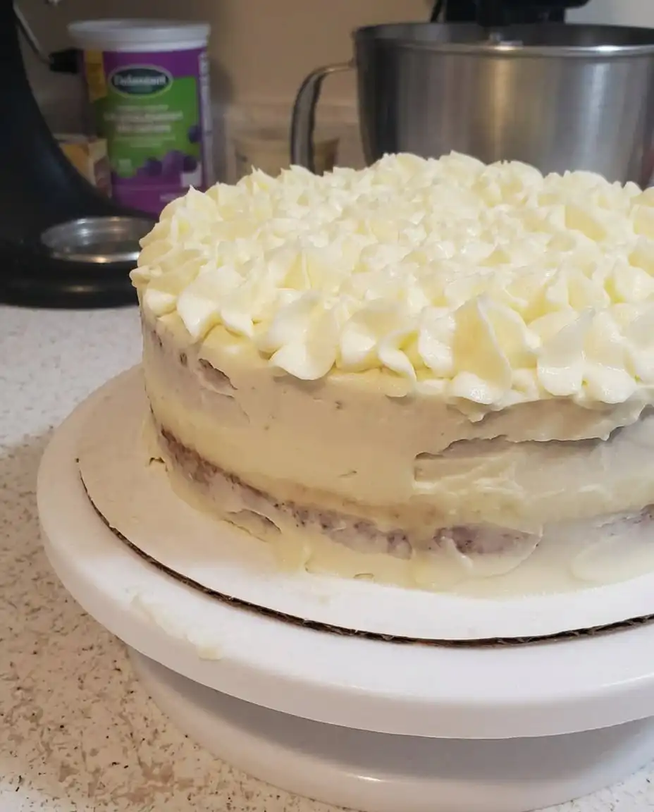 A single slice of limoncello mascarpone cake showing the layers.