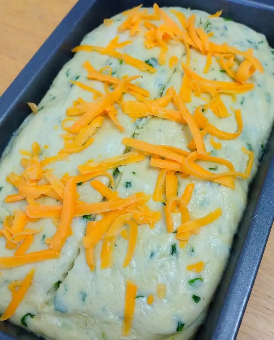 Green Onion Zucchini Cheddar Quick Bread 10 Slices of Green Onion Zucchini Cheddar Quick Bread showing a moist crumb and melted cheese pockets