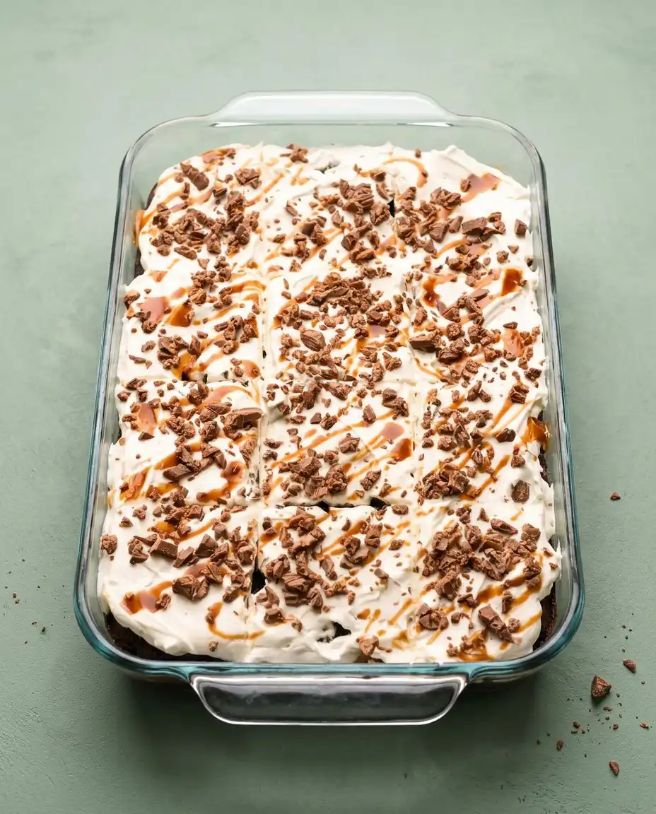 Vintage Better Than Sex Cake 16 A slice of Vintage Better Than Sex Cake served on a white plate with a fork.