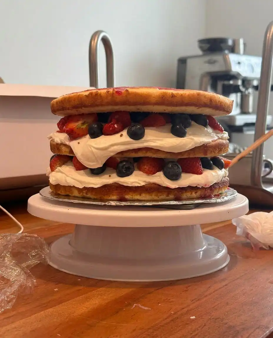 Whisk attachment pulling perfectly stiff peaks from whipped egg whites