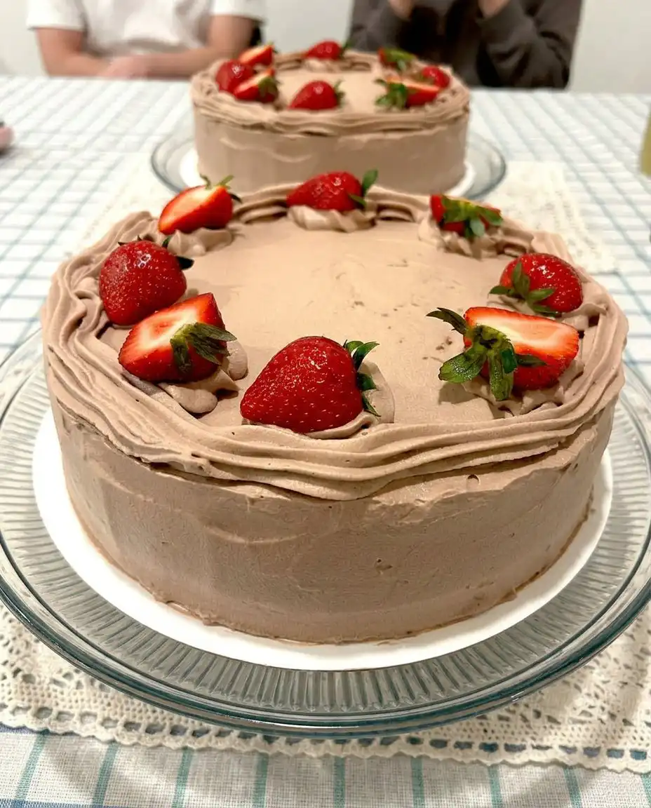 Strawberry Chocolate Cake 10 A four layer strawberry chocolate cake showing the strawberry jam filling