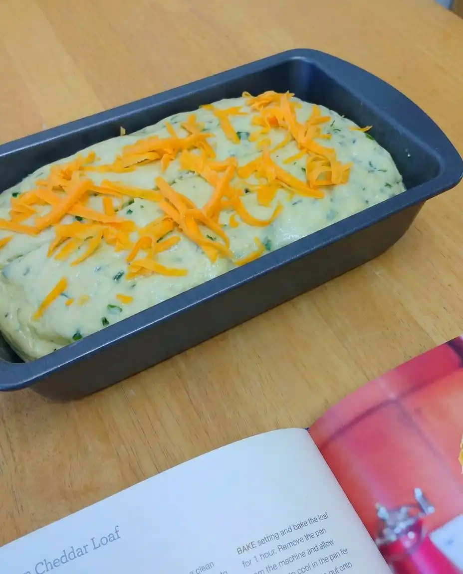 Green Onion Zucchini Cheddar Quick Bread 14 A toasted slice of Green Onion Zucchini Cheddar Quick Bread with melting butter