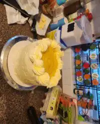 A beautiful Orange Creamsicle Cake on a vintage glass stand showing its moist crumb.