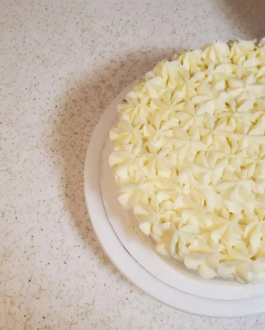 A bowl of fluffy whipped mascarpone and heavy cream.