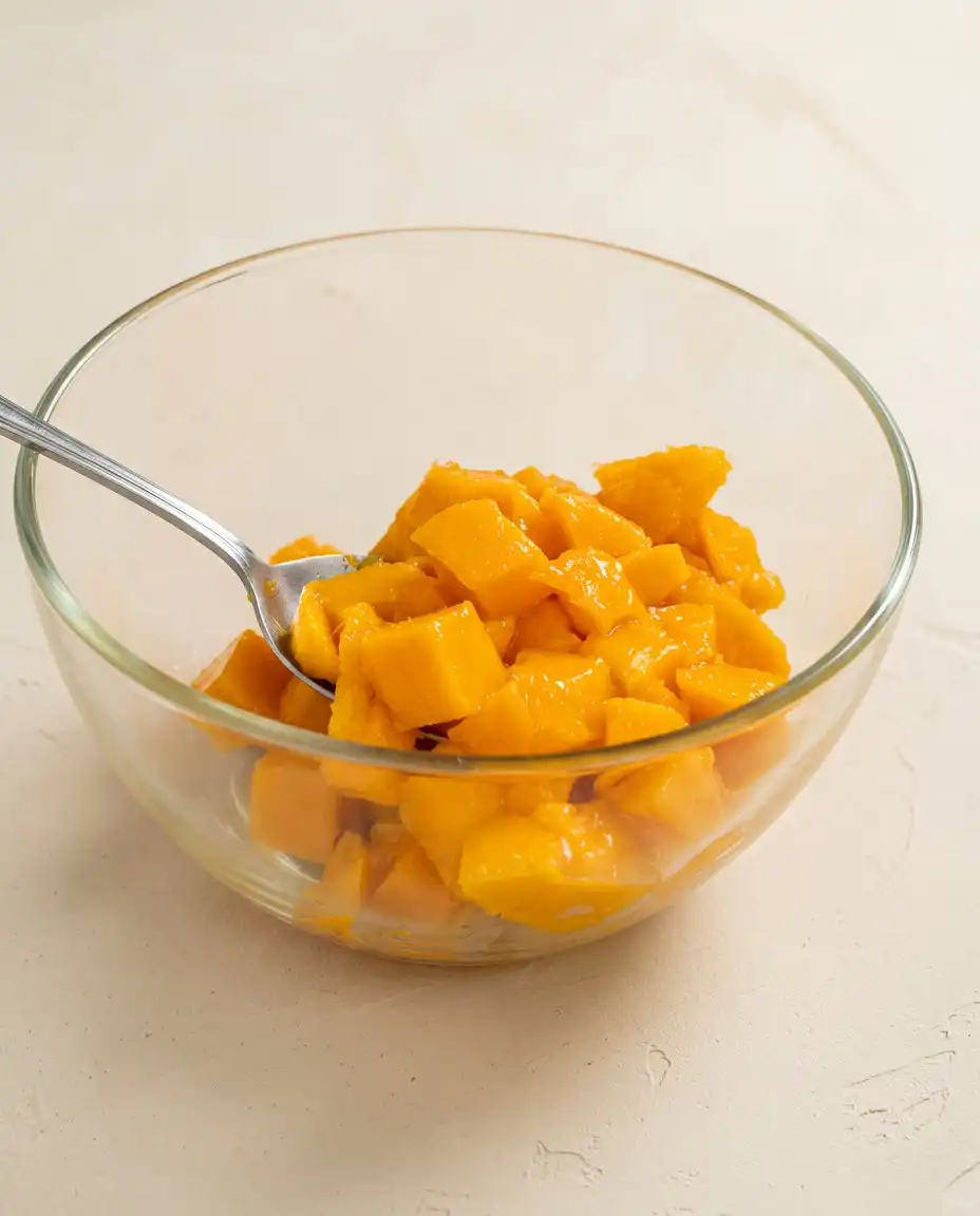 Mango Butter Cake 14 Measured baking ingredients including unsalted butter, flour, sugar, and sliced mangoes for Mango Butter Cake