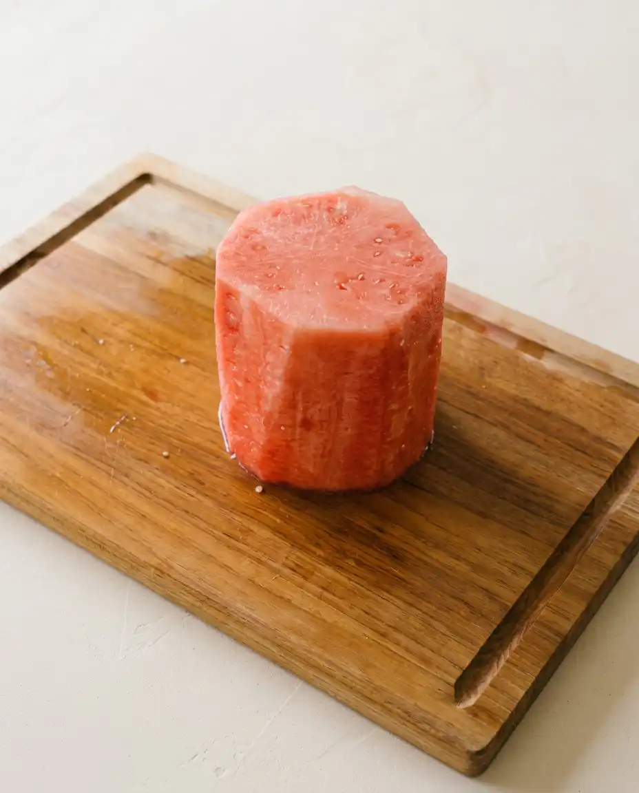 Watermelon rounds being carefully dried with paper towels for Baby's First Watermelon Yogurt Cake.