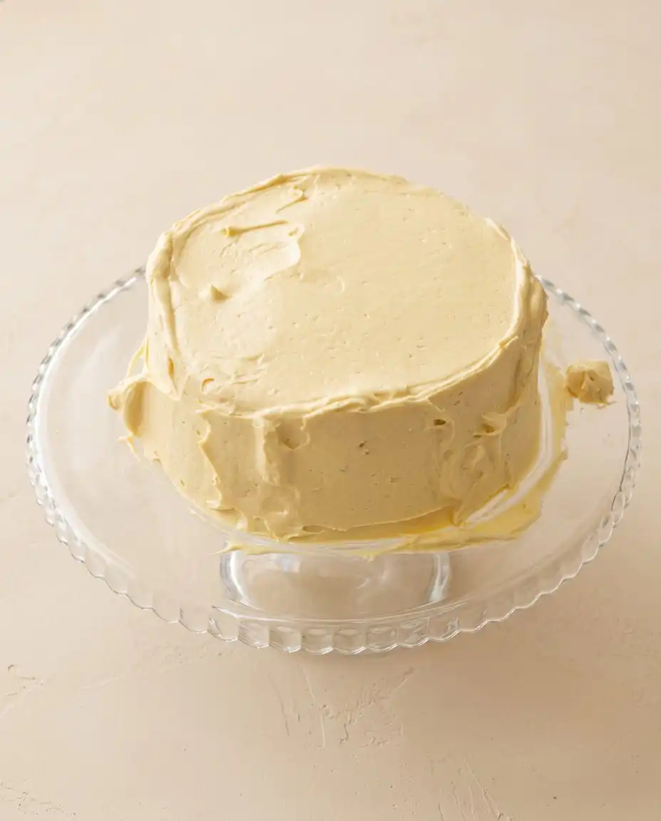 Two-Layer Peanut Butter Cake 16 A single slice of Two-Layer Peanut Butter Cake showing the tender crumb and thick frosting layers.