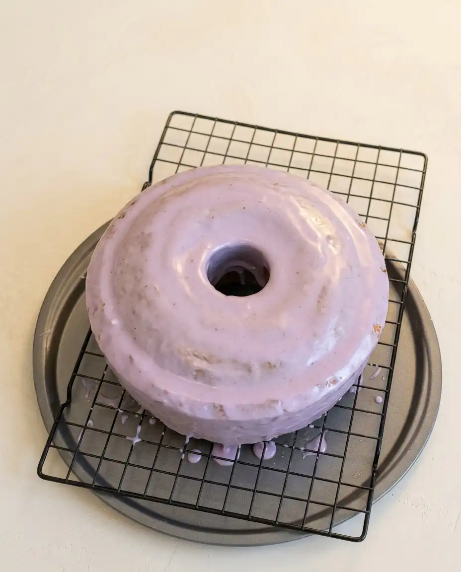 A single slice of Blackberry Pound Cake served with fresh blackberries and whipped cream.