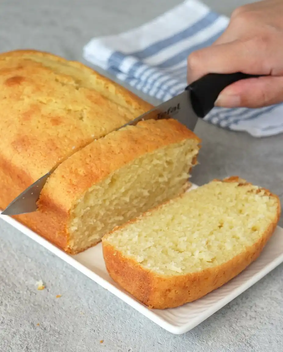 Cream Cheese Pound Cake 16 Slices of dense cream cheese pound cake served on a white ceramic plate.
